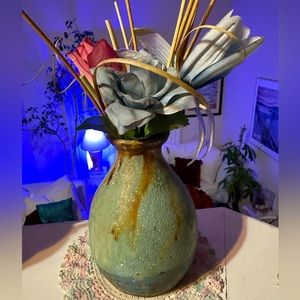 Beautiful homemade clay pottery with silk flowers